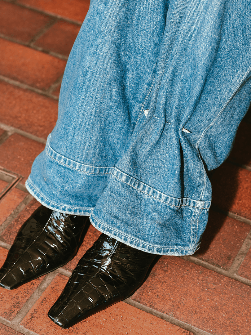 A Python brooch by Yvonne Leon styled on jeans