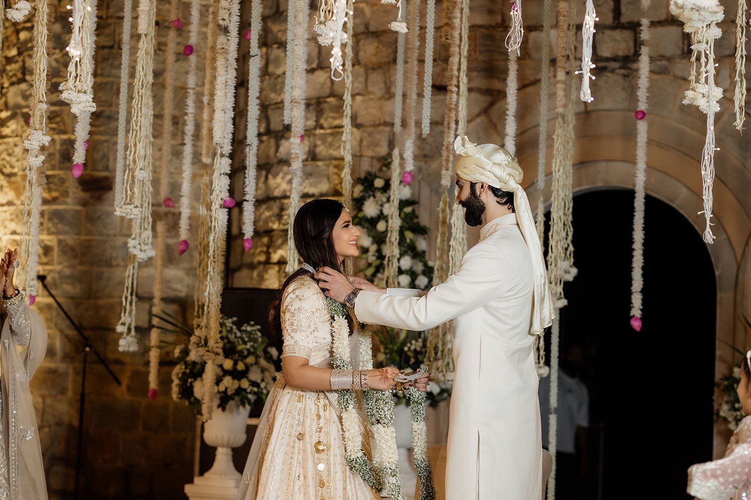 Aavriti Jain and Karan Jhangiani exchanging garlands at their wedding at Rambagh Palace in Jaipur