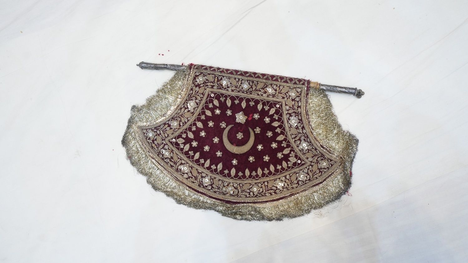 An embroidered hand fan by Afzal Miyan Karchob Wale