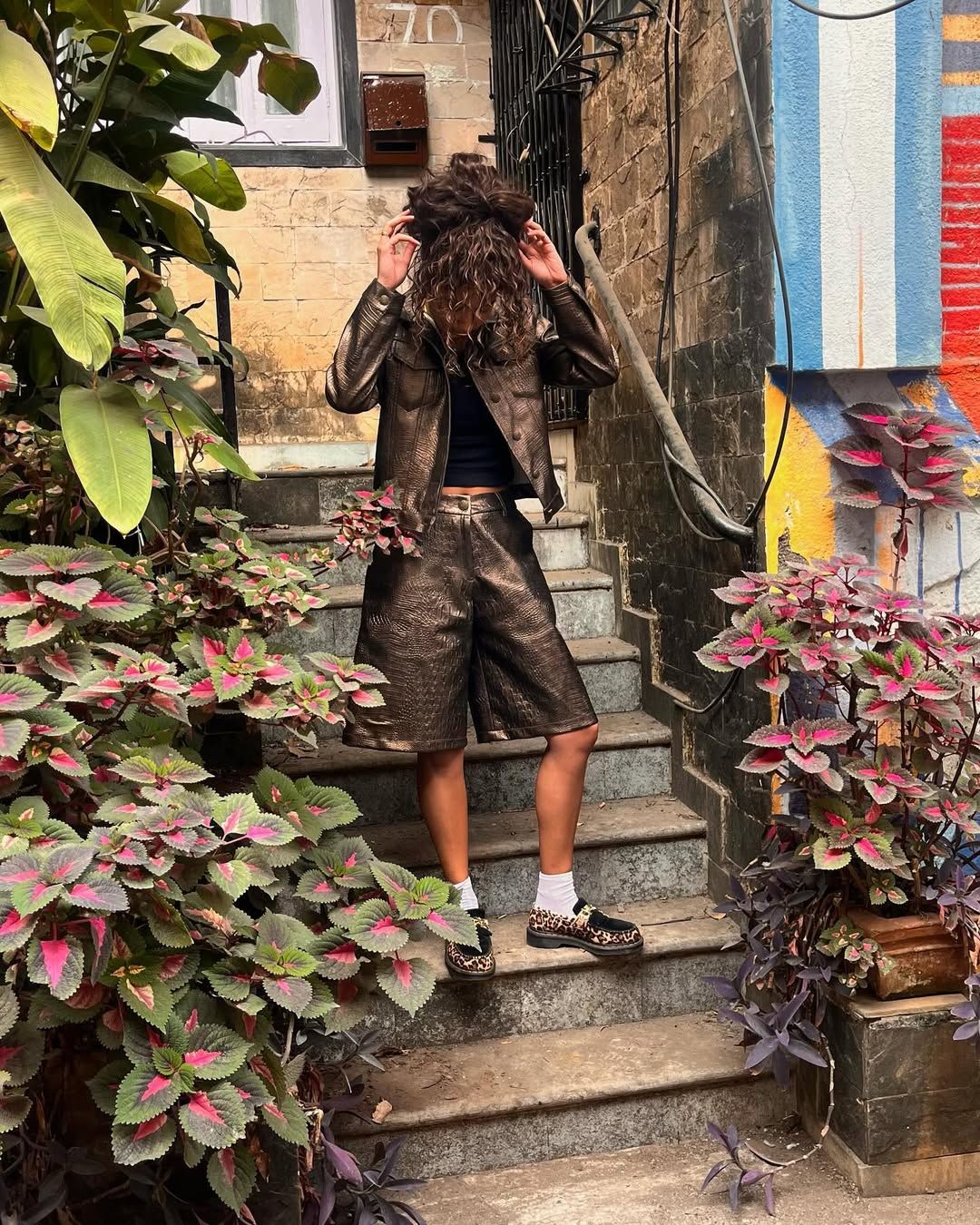 Diya Joukani in a faux Croc bronze jacket and shorts set