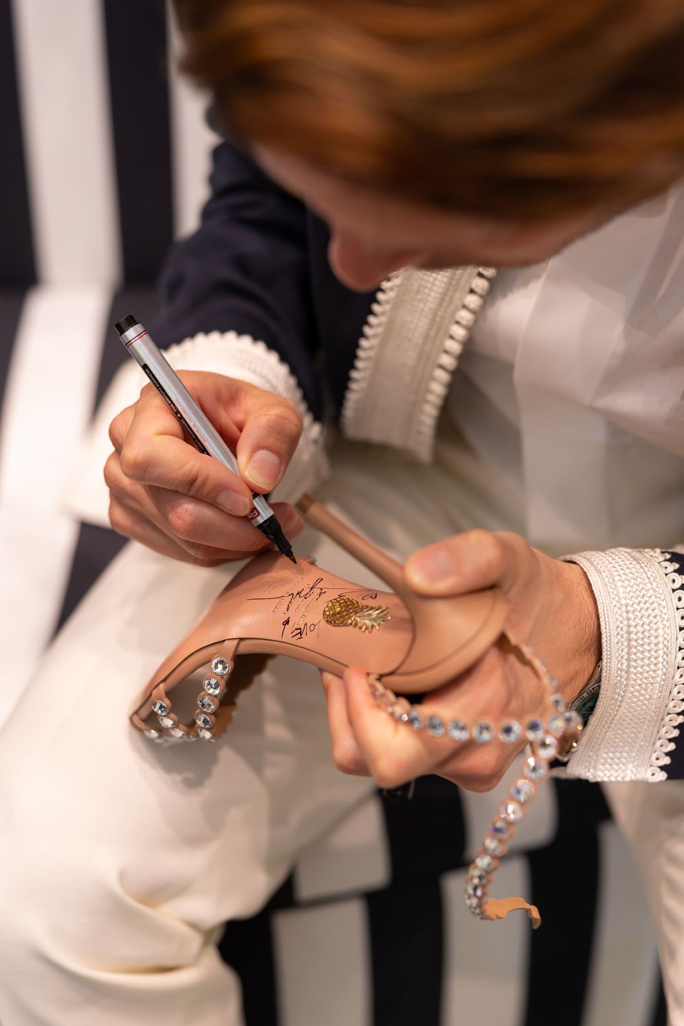 Edgardo Osorio Signing Aquazzura Shoes.jpg