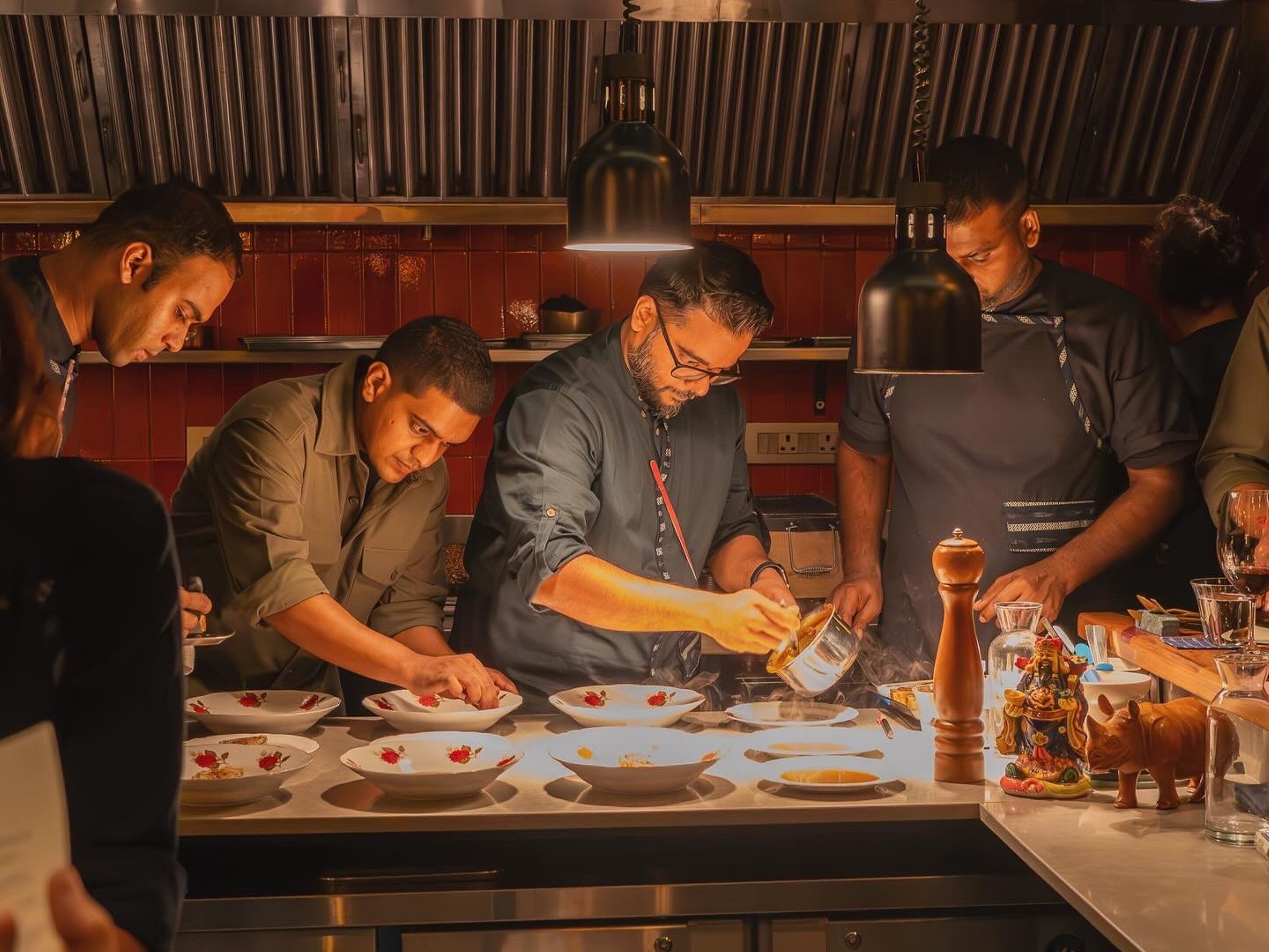 Hussain Shahzad, Executive Chef, Hunger Inc. Hospitality with the team at Papa's.JPG