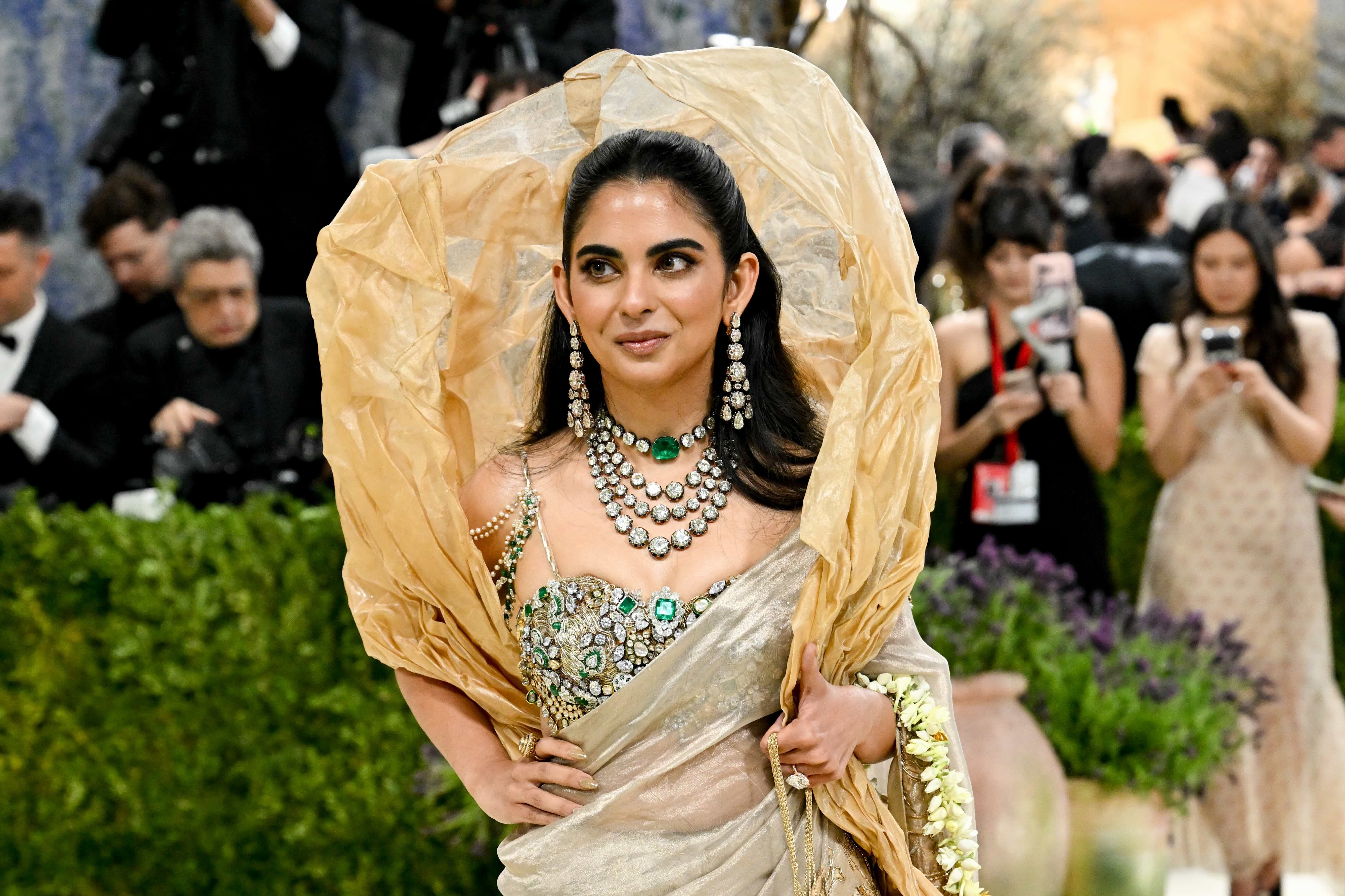 Isha Ambani at the 2026 Met Gala in a Gaurav Gupta sari. Makeup by Tanvi Chemburkar