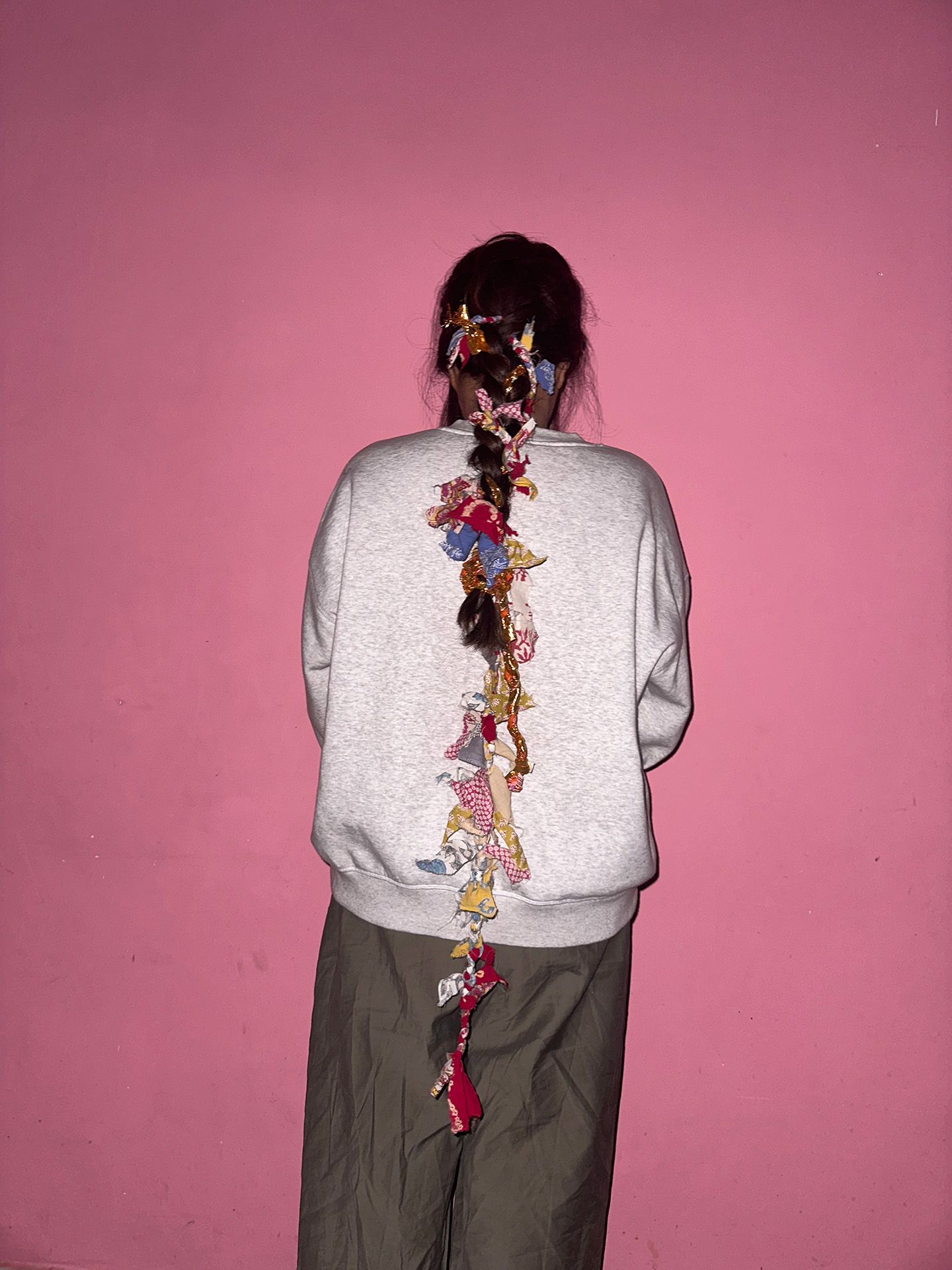 Laturia Shop founder Mihika Meena's long, messy braid adorned with parandis