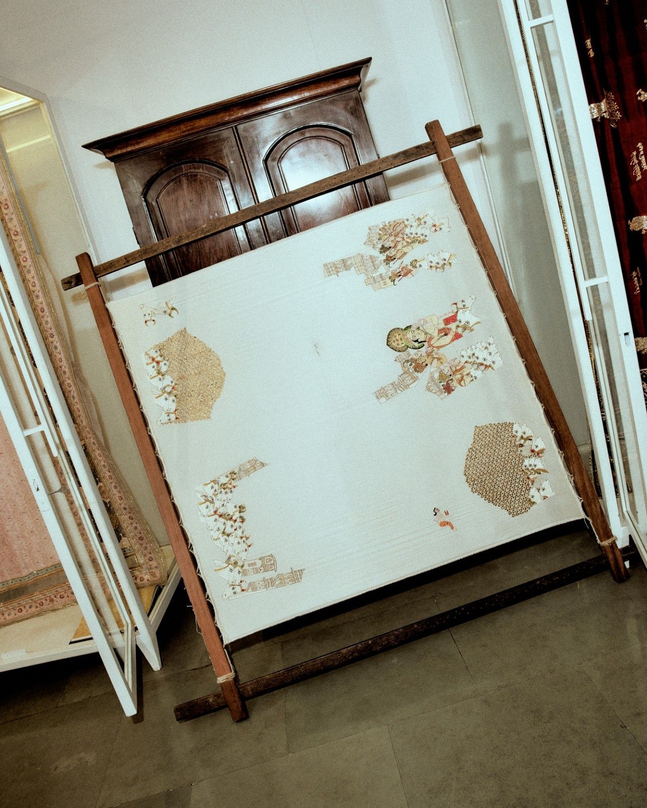 A wooden frame featuring a handloom textile in the Pankaj Heritage studio in Lado Sarai, Delhi