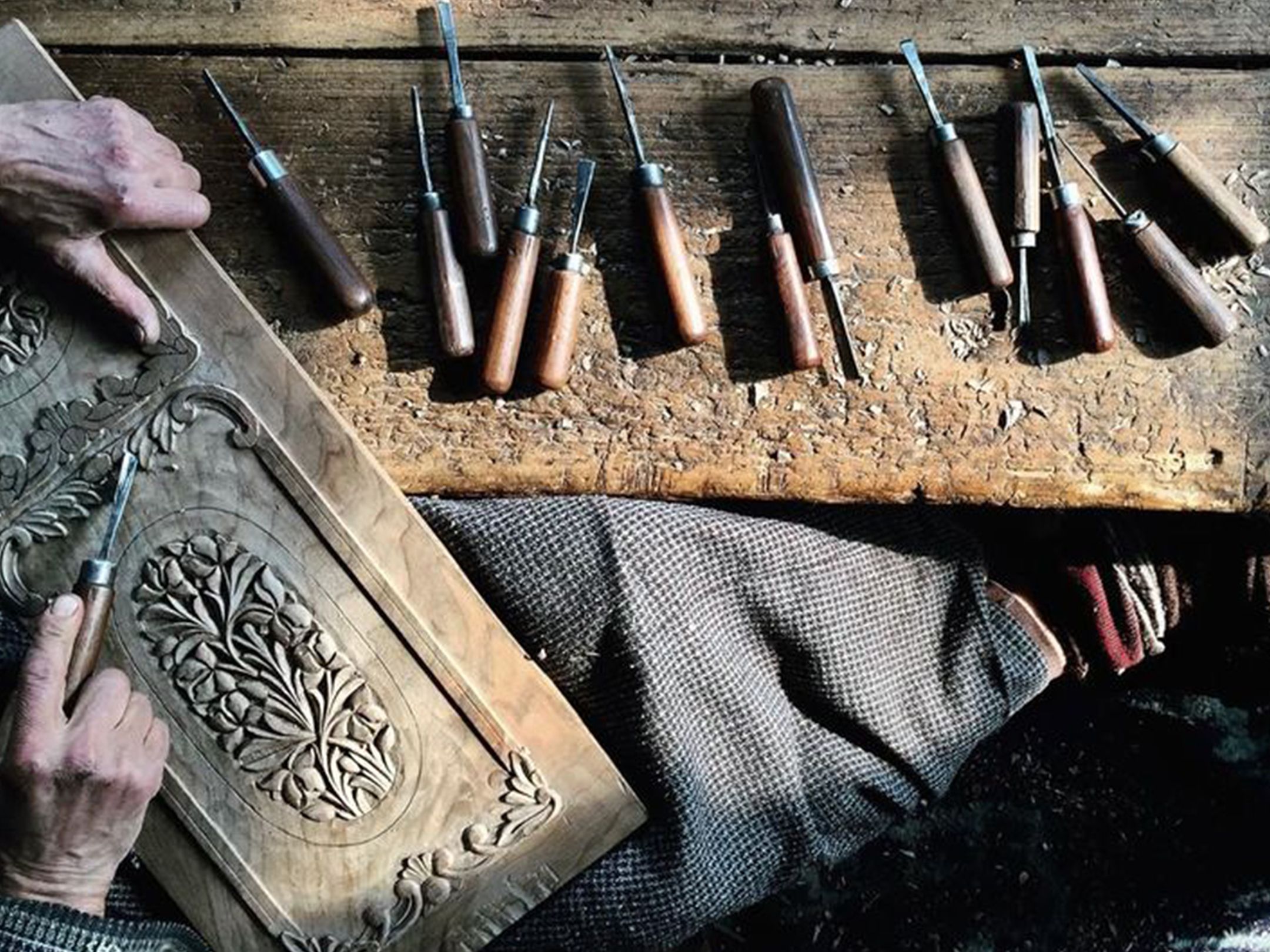 Artisan working on a fine line nakashi painting