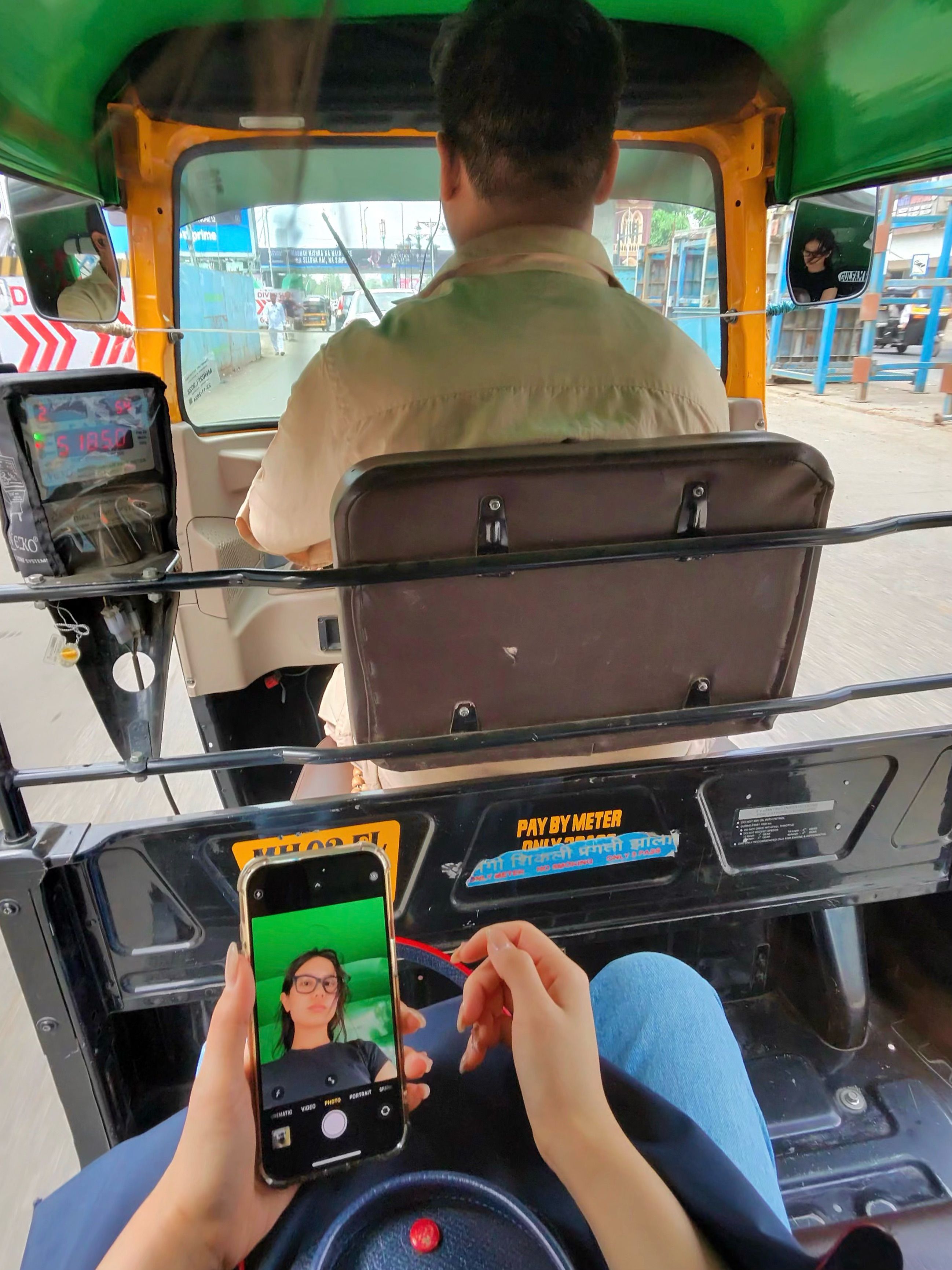 Chloe Chou, a fashion and beauty writer at The Nod testing the Ray-Ban Meta glasses in a rickshaw