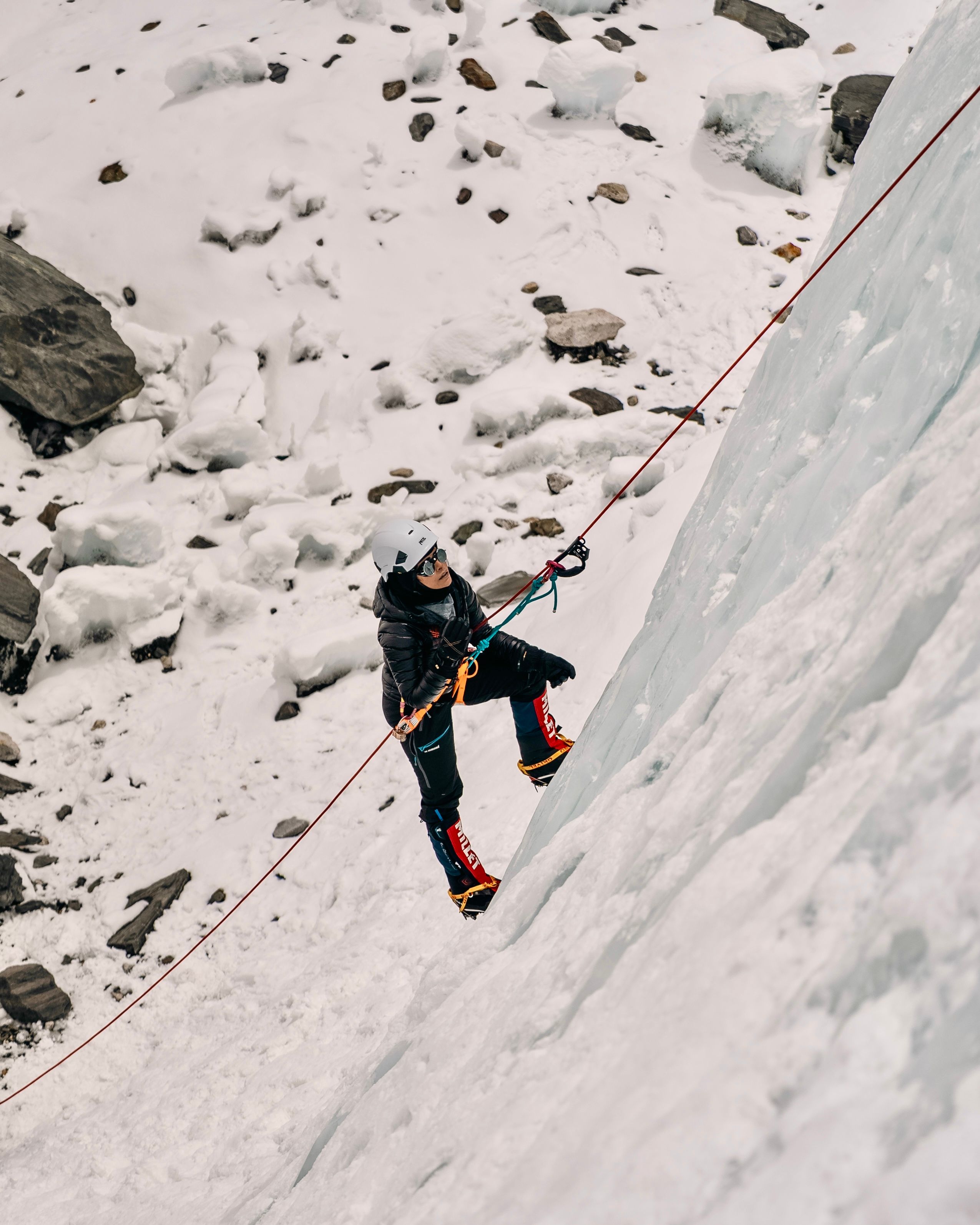 Rii scaling a steep ascent to reach Everest Base Camp