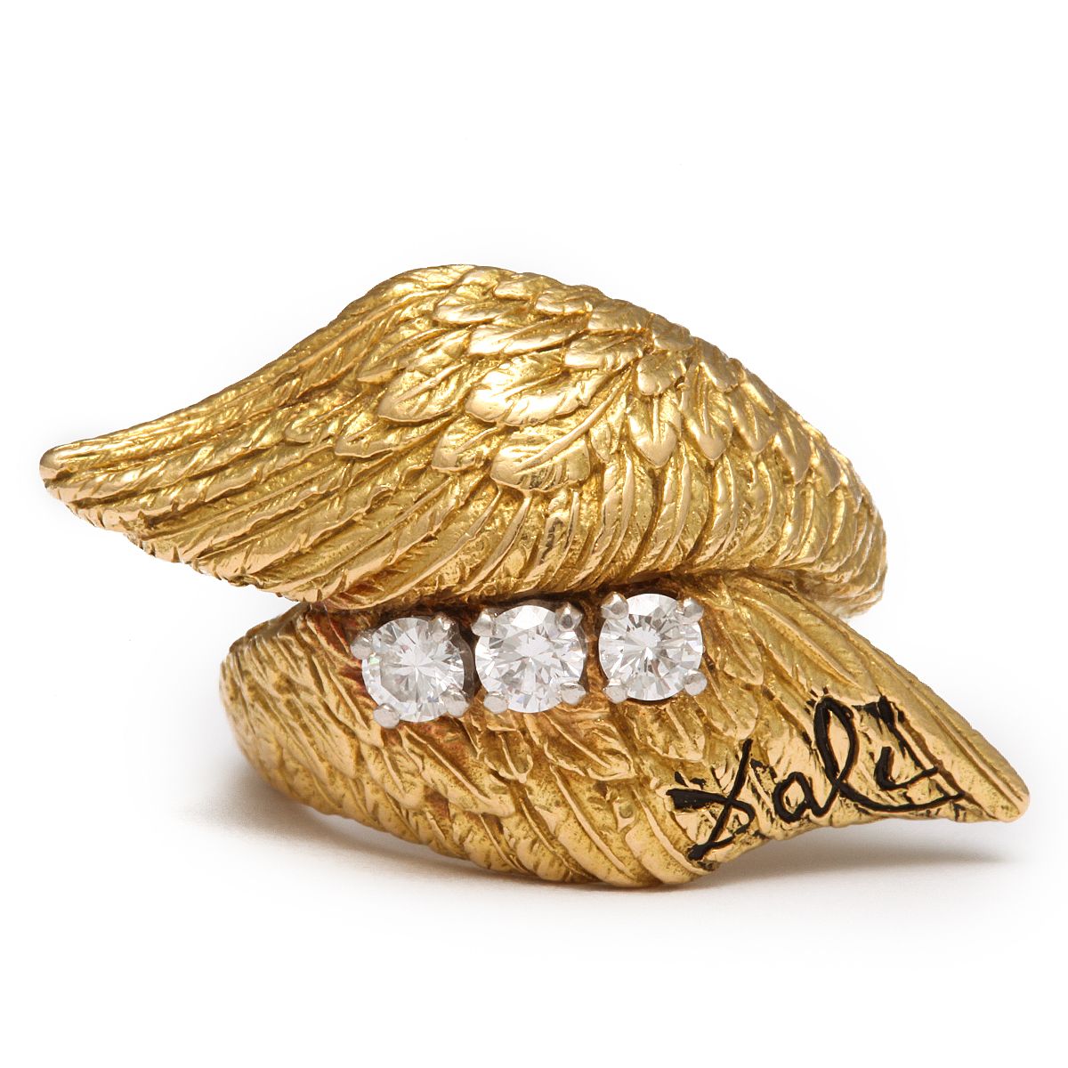 A gold ring designed by Salvador Dali with angel wings