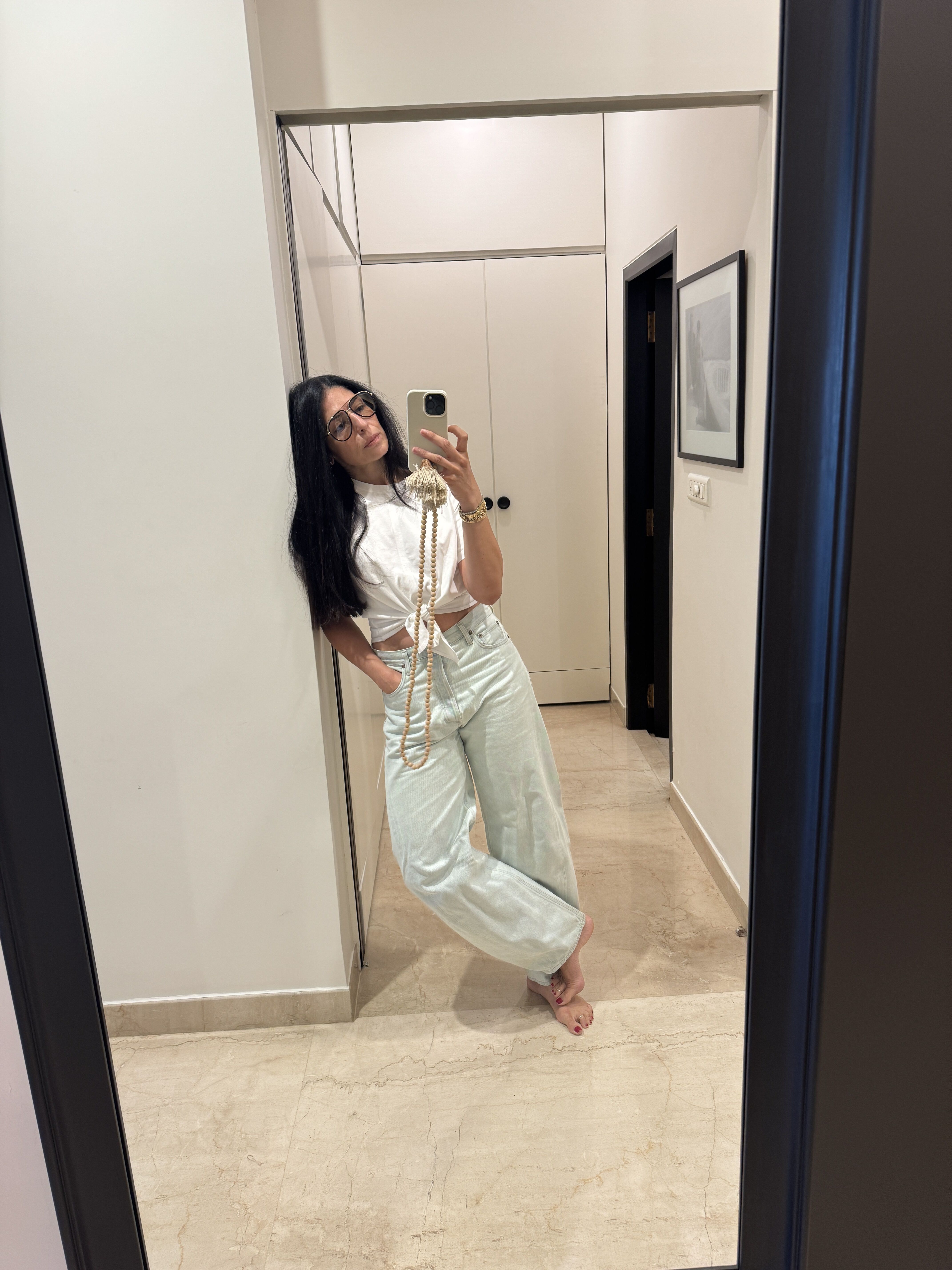 Film producer Shaana Levy in a white t-shirt and jeans