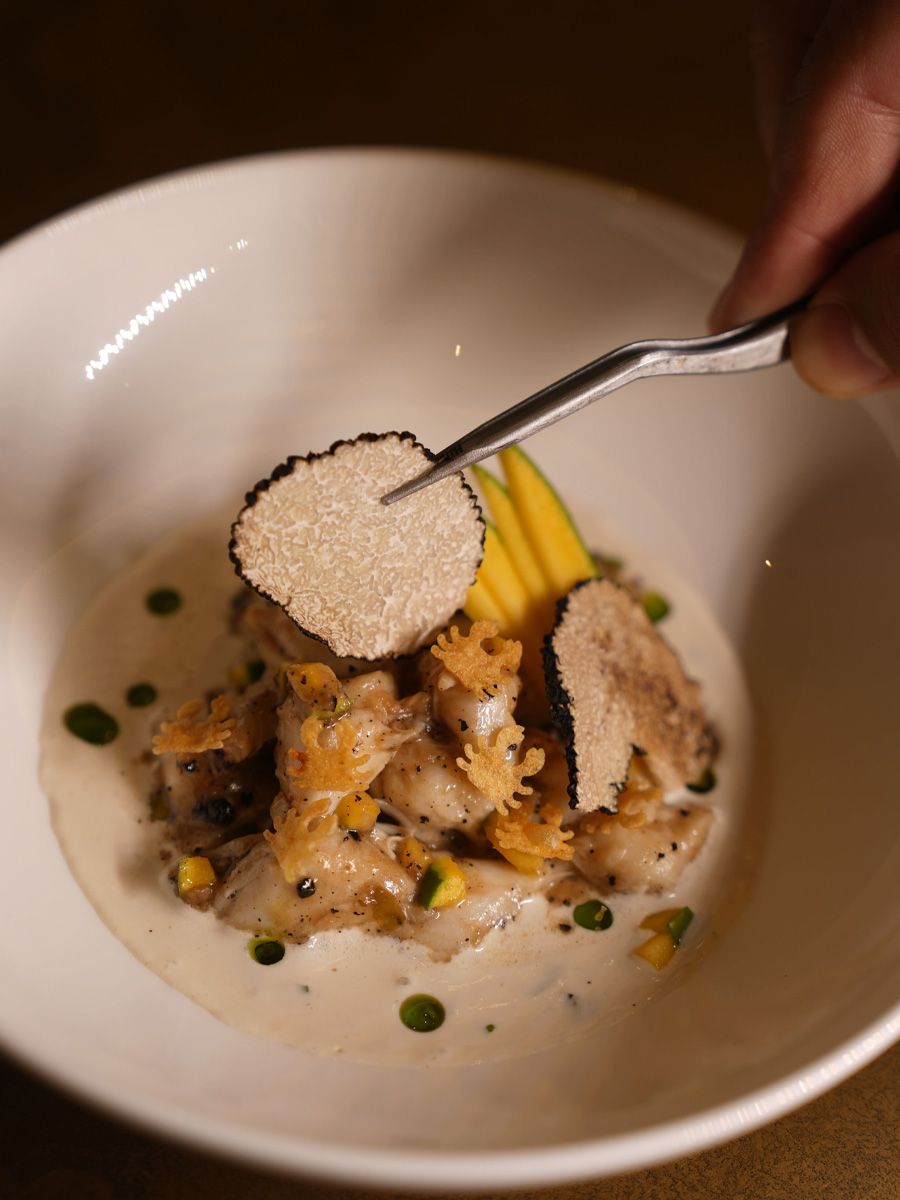 Crab varuval, pepper butter, black truffle Indian Accent The Nod