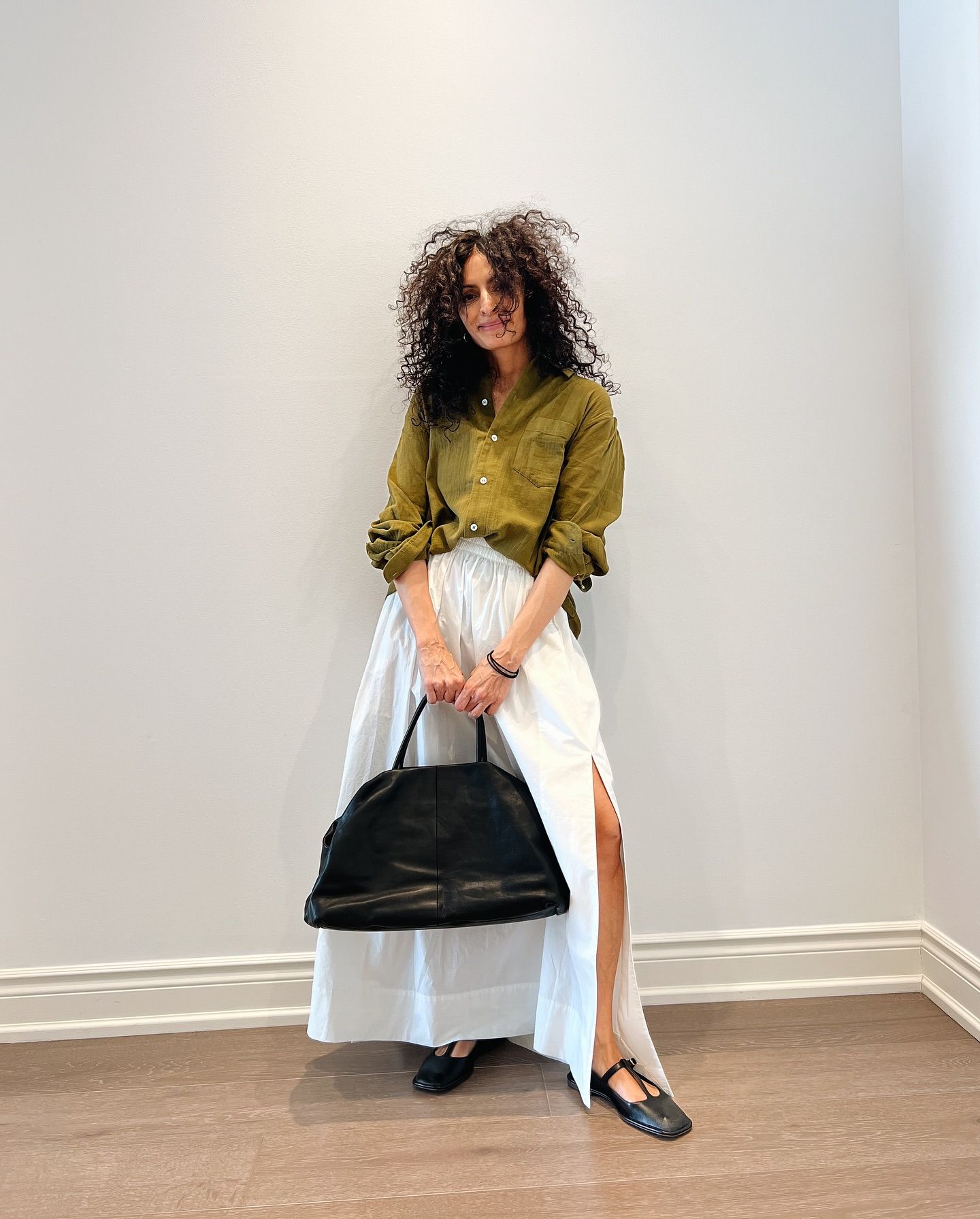 Neelam Ahooja in a Séfr shirt, old Cos skirt, The Row T-Strap sandals, and Elio bag